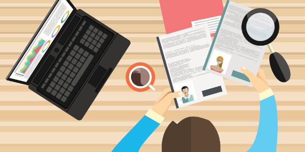 illustration of person with laptop and resumes