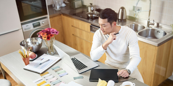 Man working from home, in his kitchen