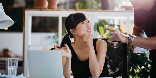 Woman sits at computer