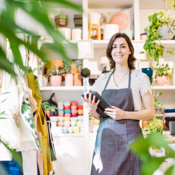Retail employee greets customers