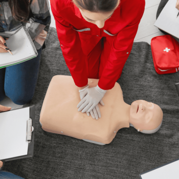 Employees participate in CPR training course.